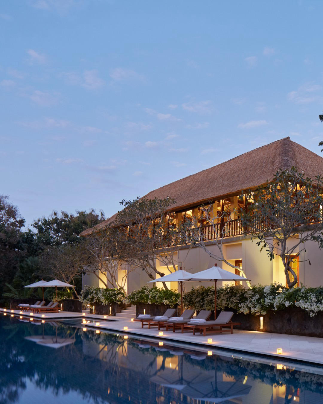 image  1 Aman Villas at Nusa Dua - The approach of twilight suffuses the sky with purple and orange, setting